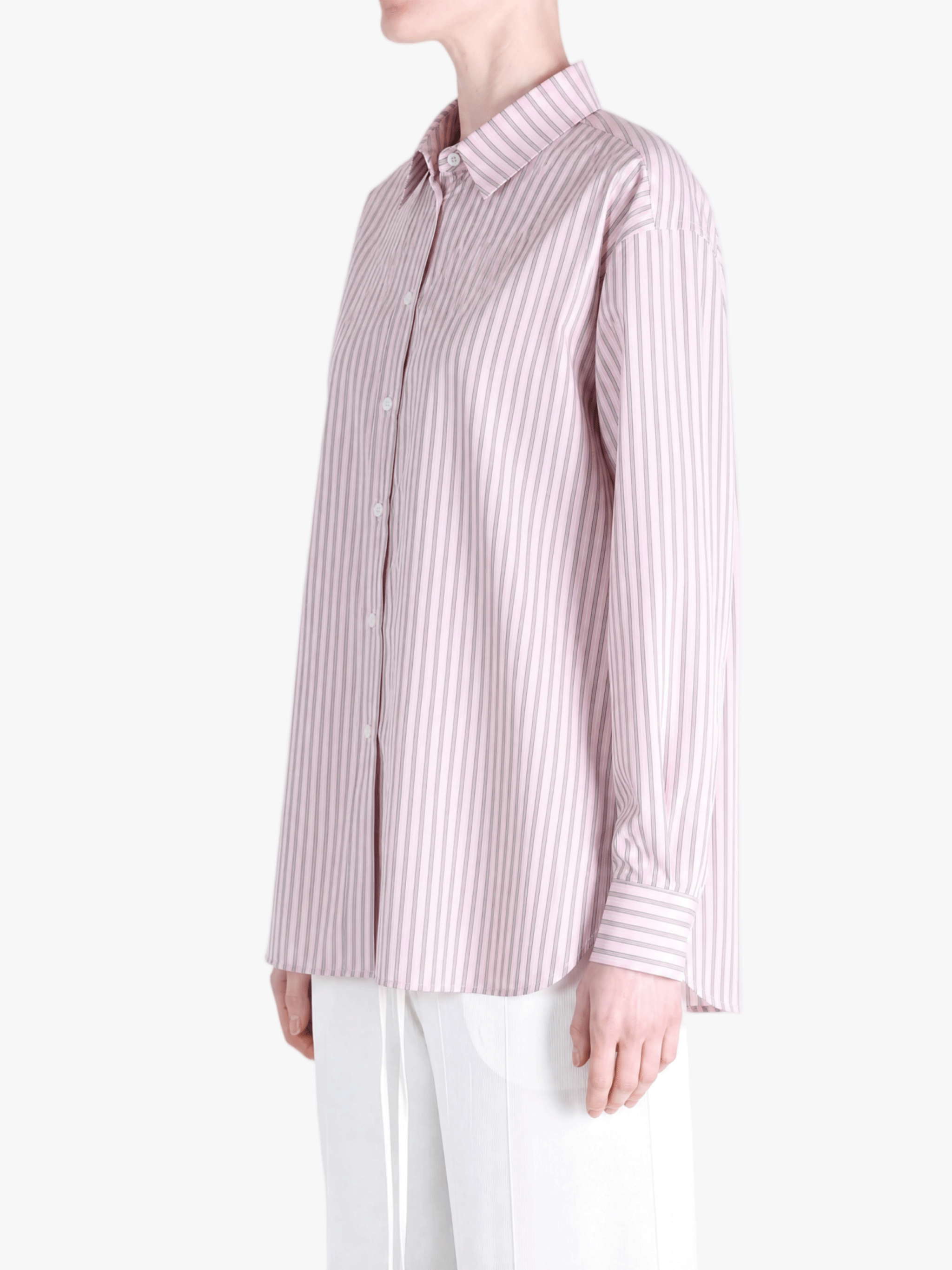 Pink shirt worn by a person, showing the shirt fit
