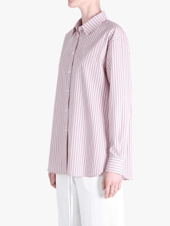 Pink shirt worn by a person, showing the shirt fit