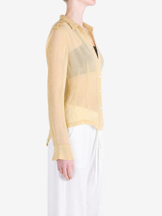 Tan shirt worn by a person, showing the shirt fit