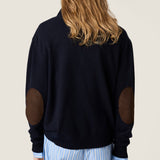 Brown sweater  worn by a person, showing the sweater 's fit