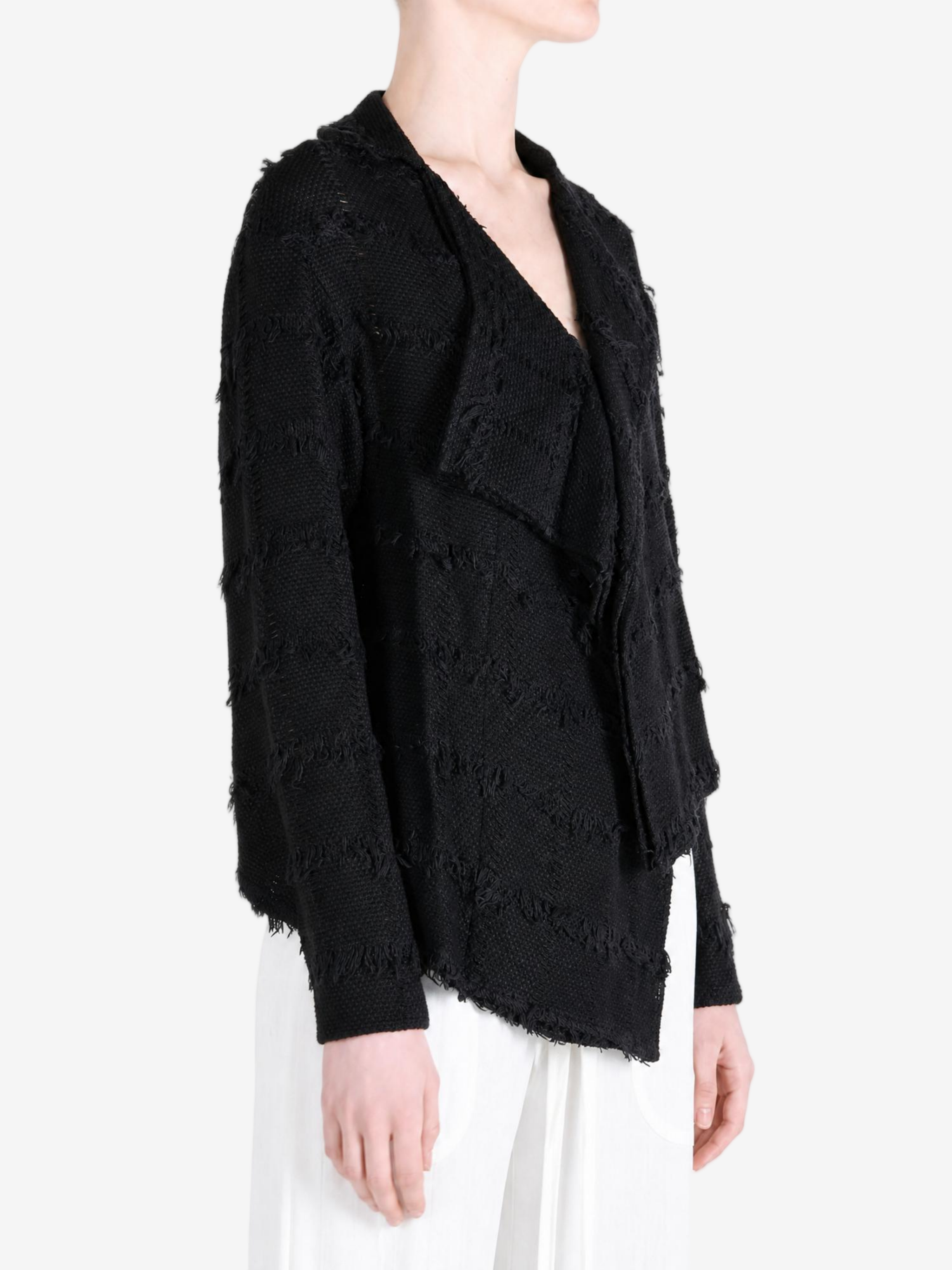 Black shirt worn by a person, showing the shirt fit
