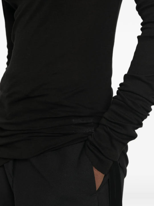 Black t-shirt worn by a person, showing the t-shirt fit