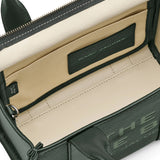 Close up of green bag, showing texture of the leather fabric