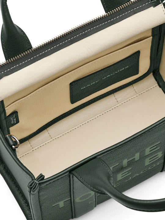 Close up of green bag, showing texture of the leather fabric