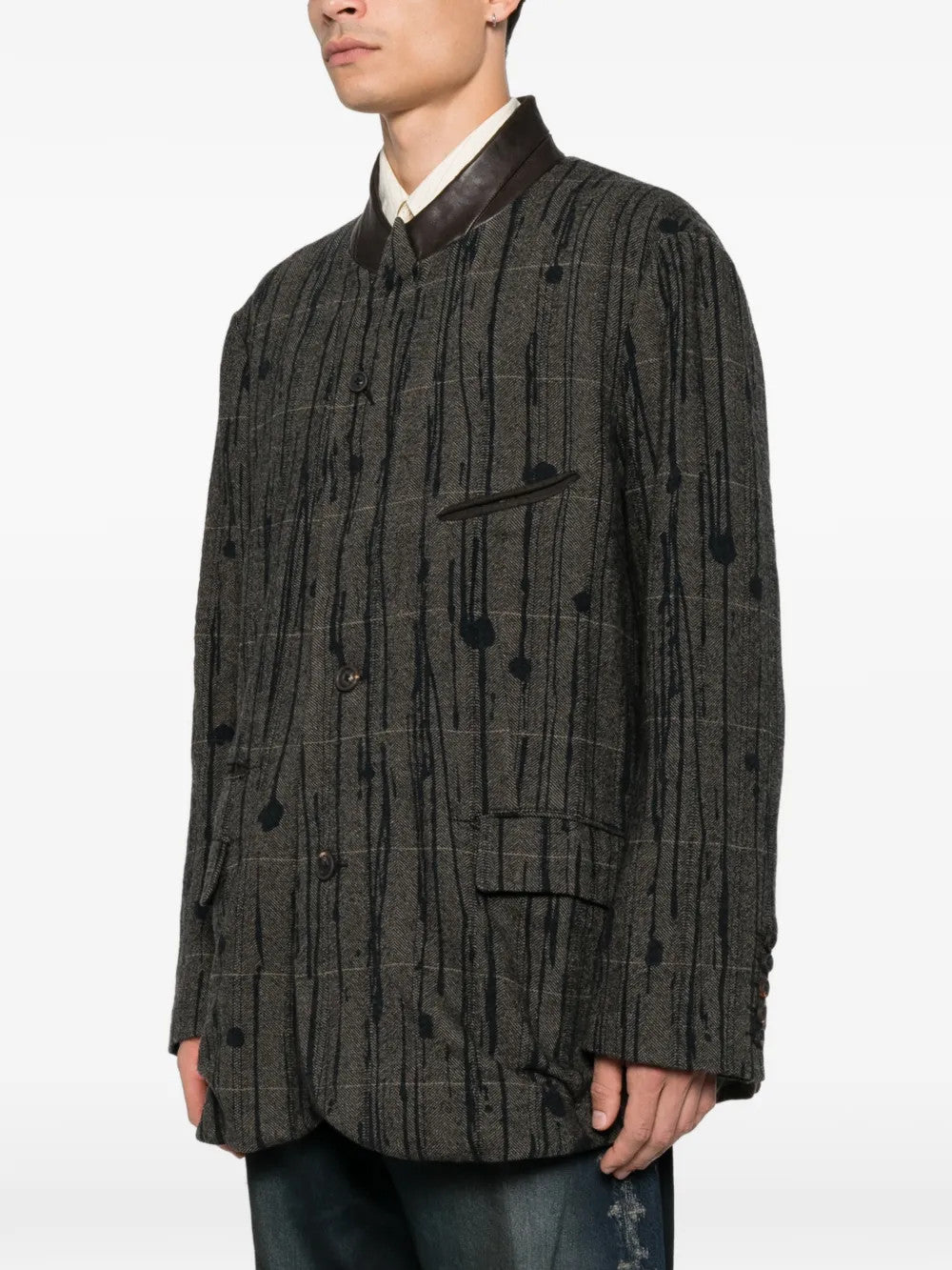 Grey blazer worn by a person, showing the blazer fit