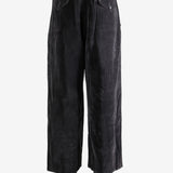 Brown pants worn by a person, showing the pants' fit