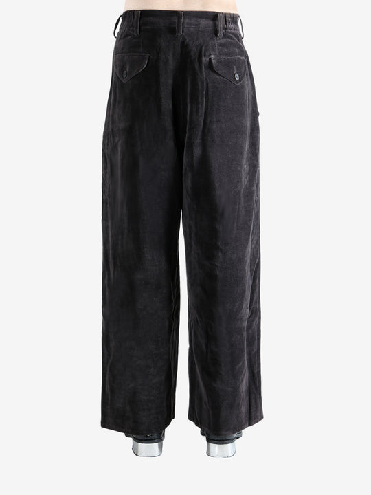 Brown pants worn by a person, showing the pants' fit