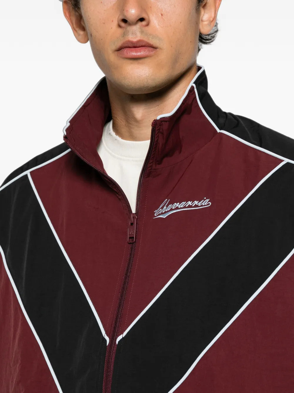 Burgundy jacket worn by a person, showing the jacket fit