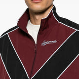 Burgundy jacket worn by a person, showing the jacket fit