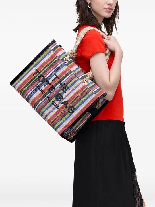 Red bag worn by a person, showing the bag's fit