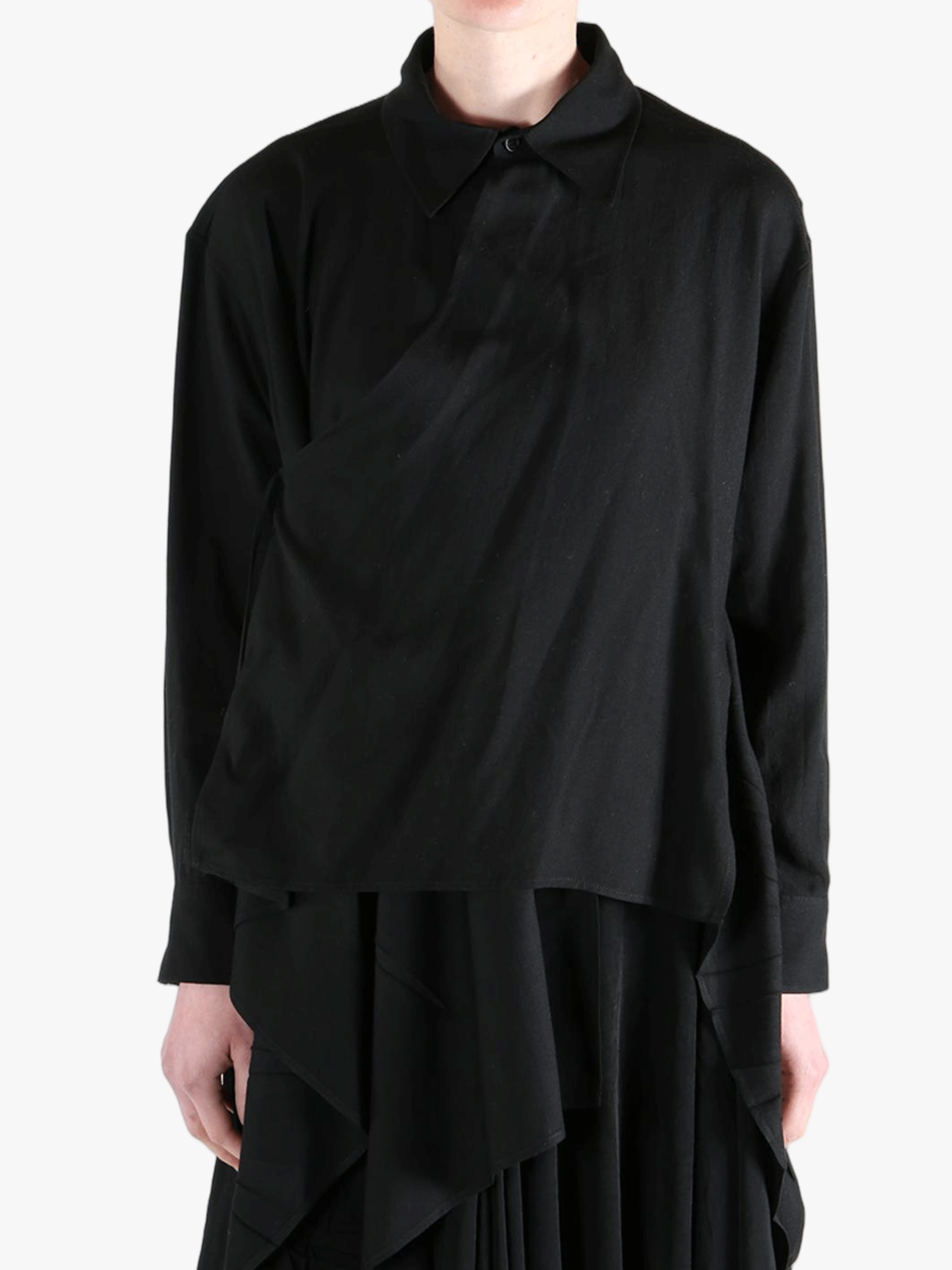 Black shirt worn by a person, showing the shirt's fit