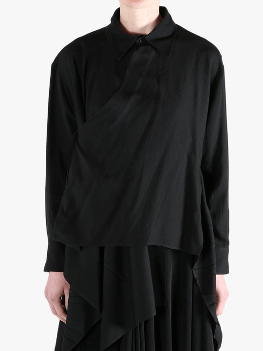 Black shirt worn by a person, showing the shirt's fit