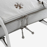 Close up of white bags, showing texture of the fabric