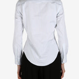 Blue shirt worn by a person, showing the shirt's fit