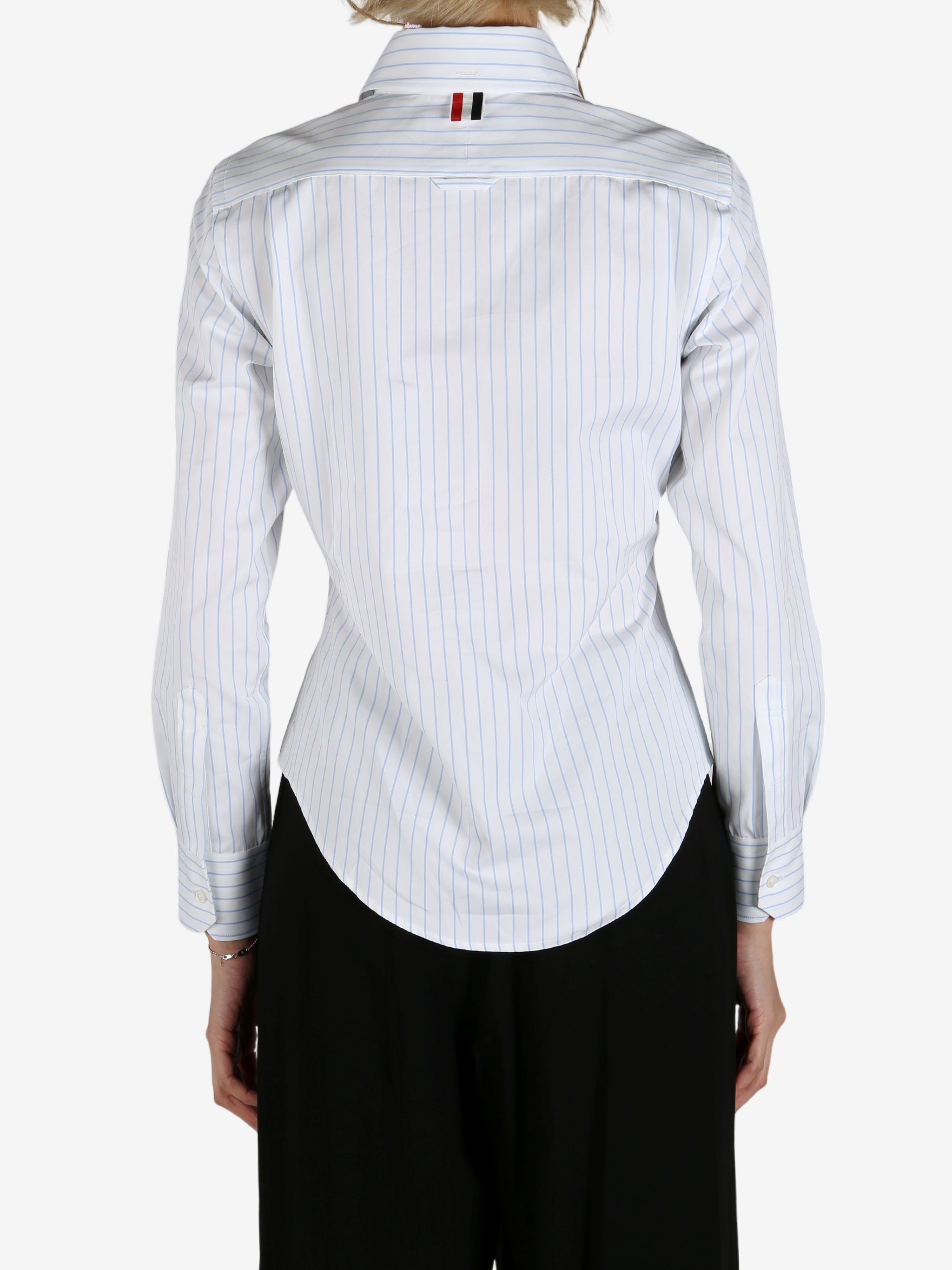 Blue shirt worn by a person, showing the shirt's fit