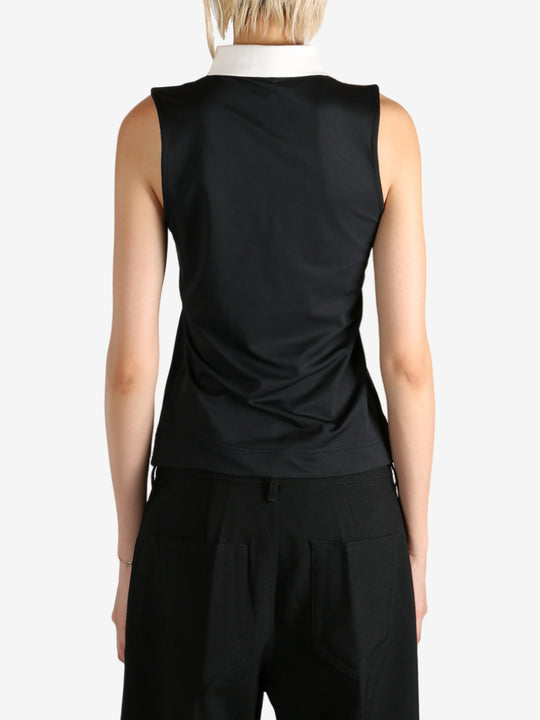 Black shirts worn by a person, showing the shirts fit