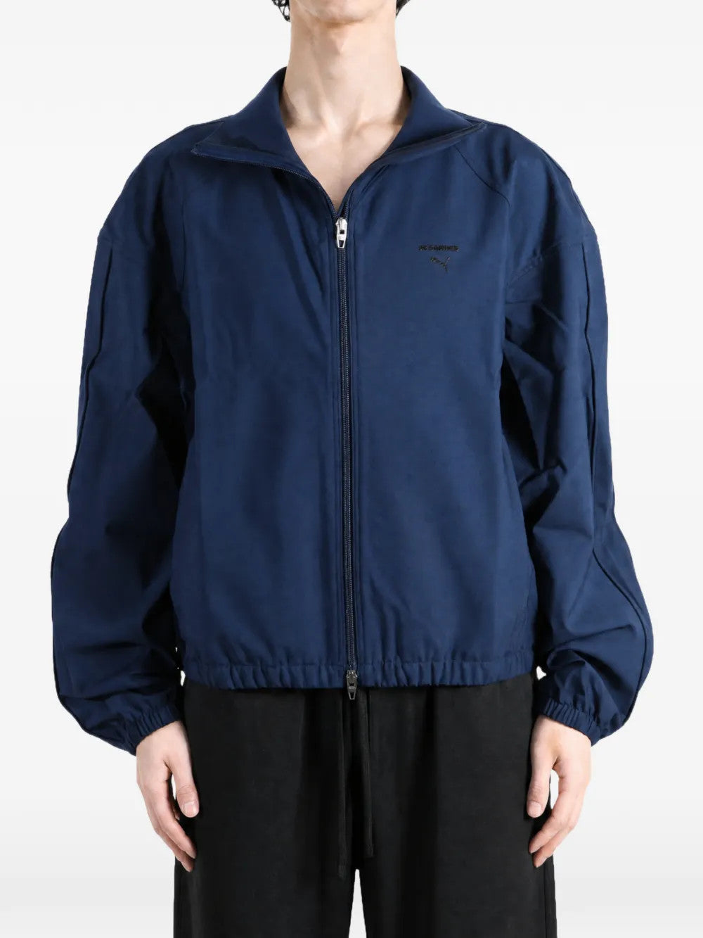 Navy jacket worn by a person, showing the jacket fit