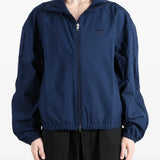 Navy jacket worn by a person, showing the jacket fit