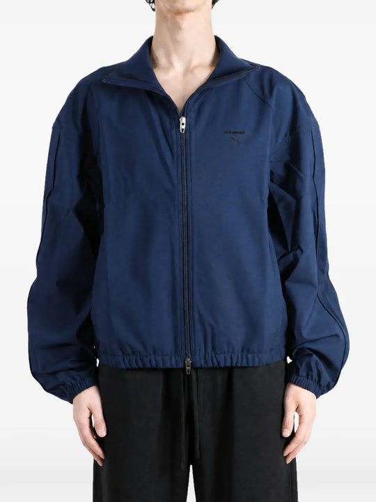 Navy jacket worn by a person, showing the jacket fit