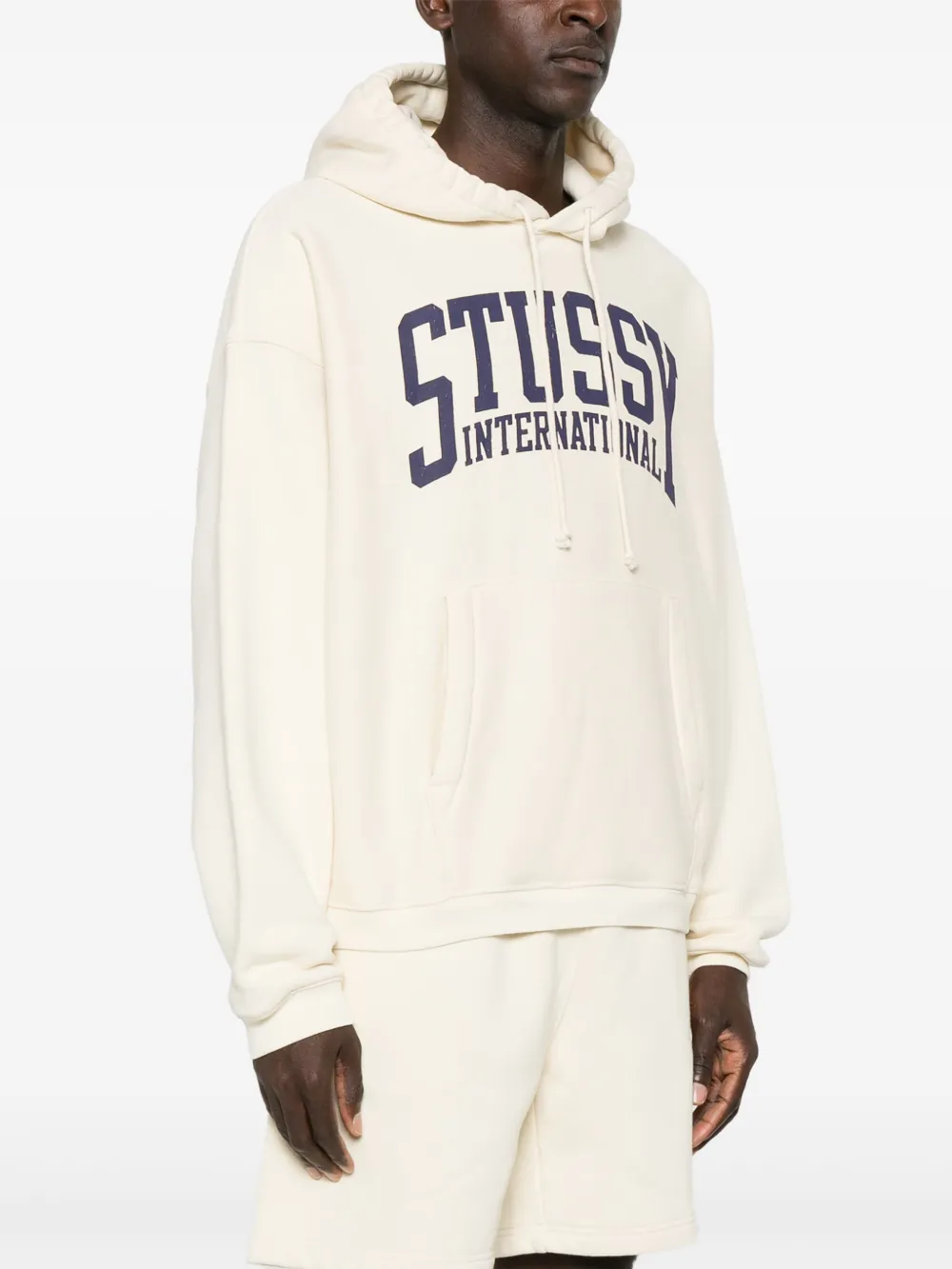 White hoodies worn by a person, showing the hoodies fit