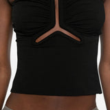 Black top worn by a person, showing the top fit