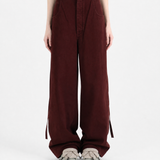 Burgundy pants, full body view