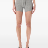 Grey shorts worn by a person, showing the shorts fit