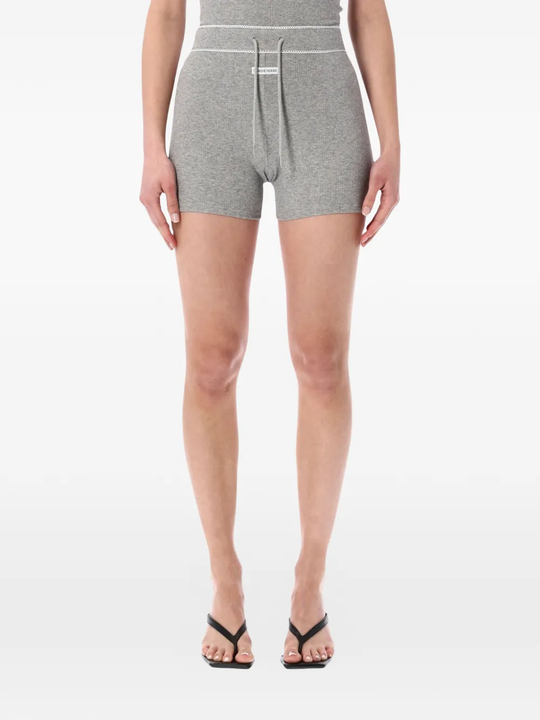 Grey shorts worn by a person, showing the shorts fit