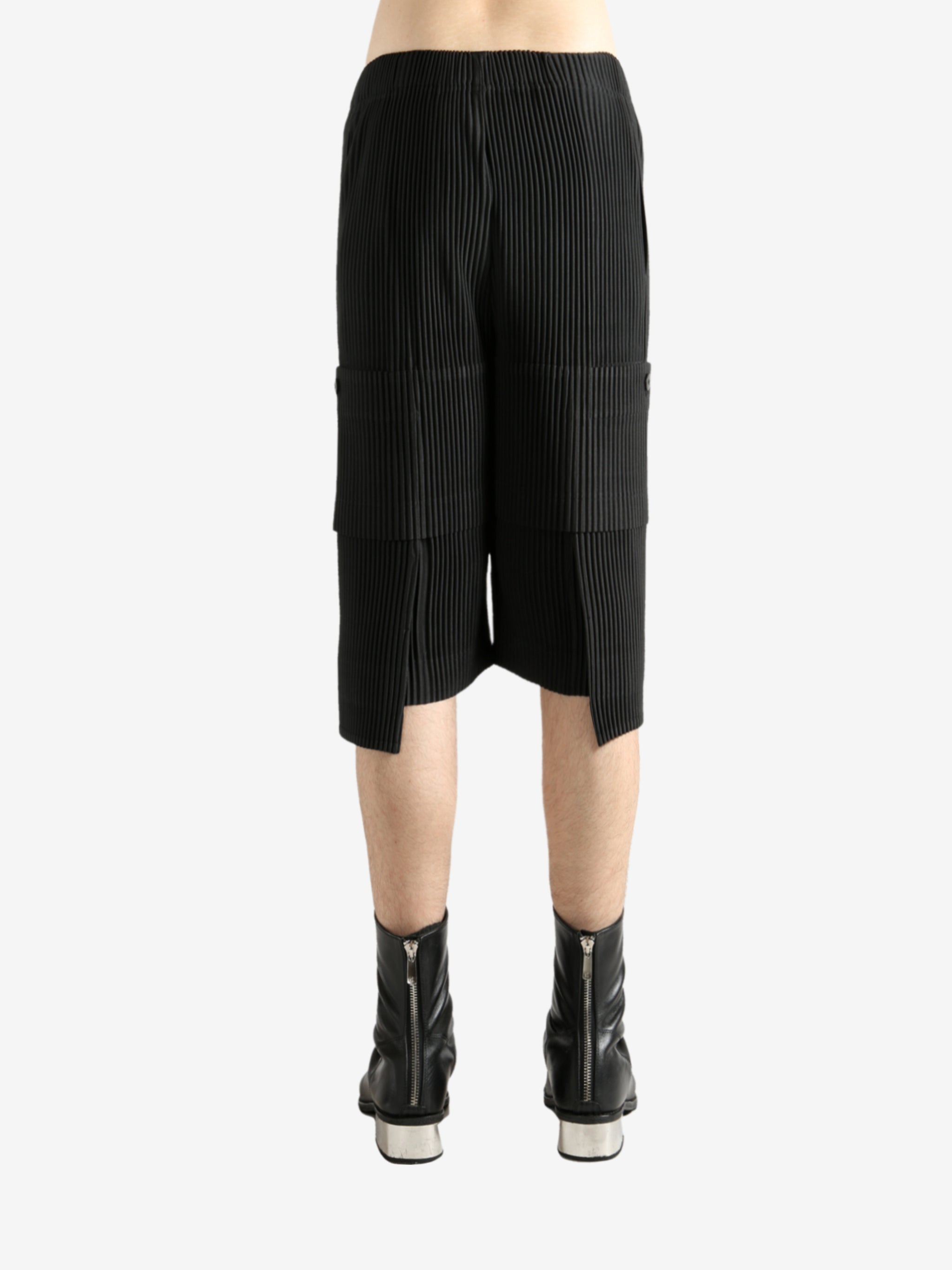 Black shorts worn by a perosn, showing the short's fit