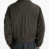 Brown coat worn by a person, showing the coat's fit