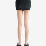 Black skirt worn by a person, showing the skirt's fit