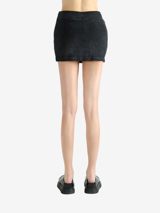 Black skirt worn by a person, showing the skirt's fit