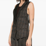 Tan coats worn by a person, showing the coats fit