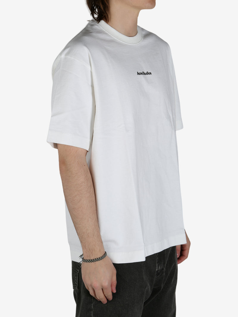 White shirt worn by a person, showing the shirt's fit