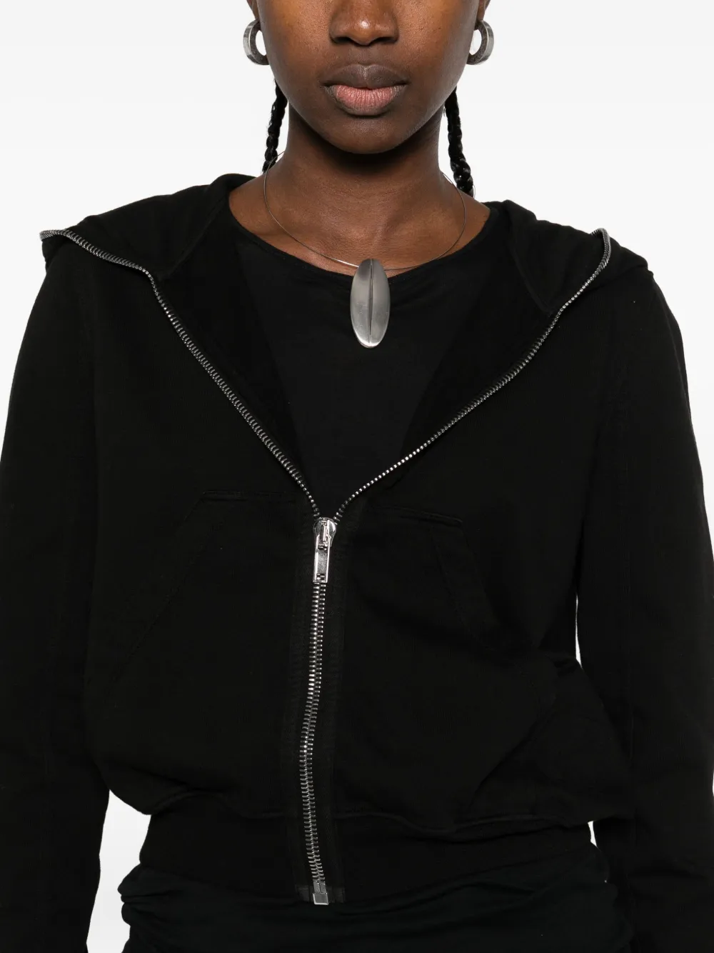 Close up of the black hoodie, showing texture of the cotton fabric