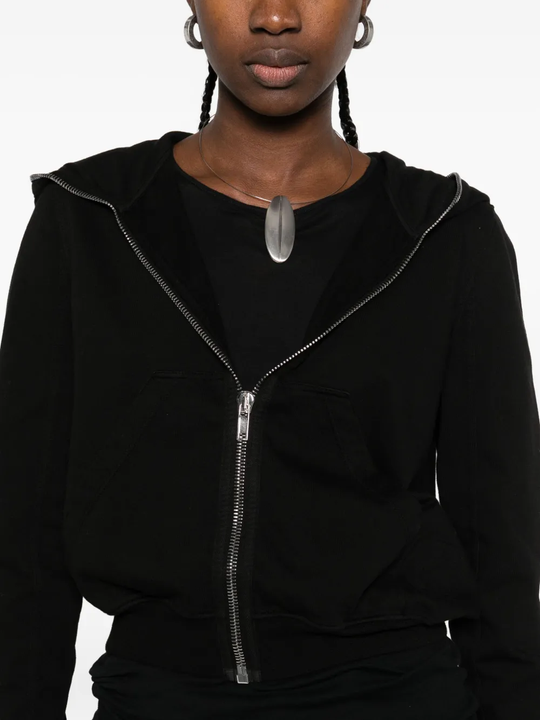 Close up of the black hoodie, showing texture of the cotton fabric