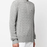 Grey sweater, worn by a person, showing the sweater's fit