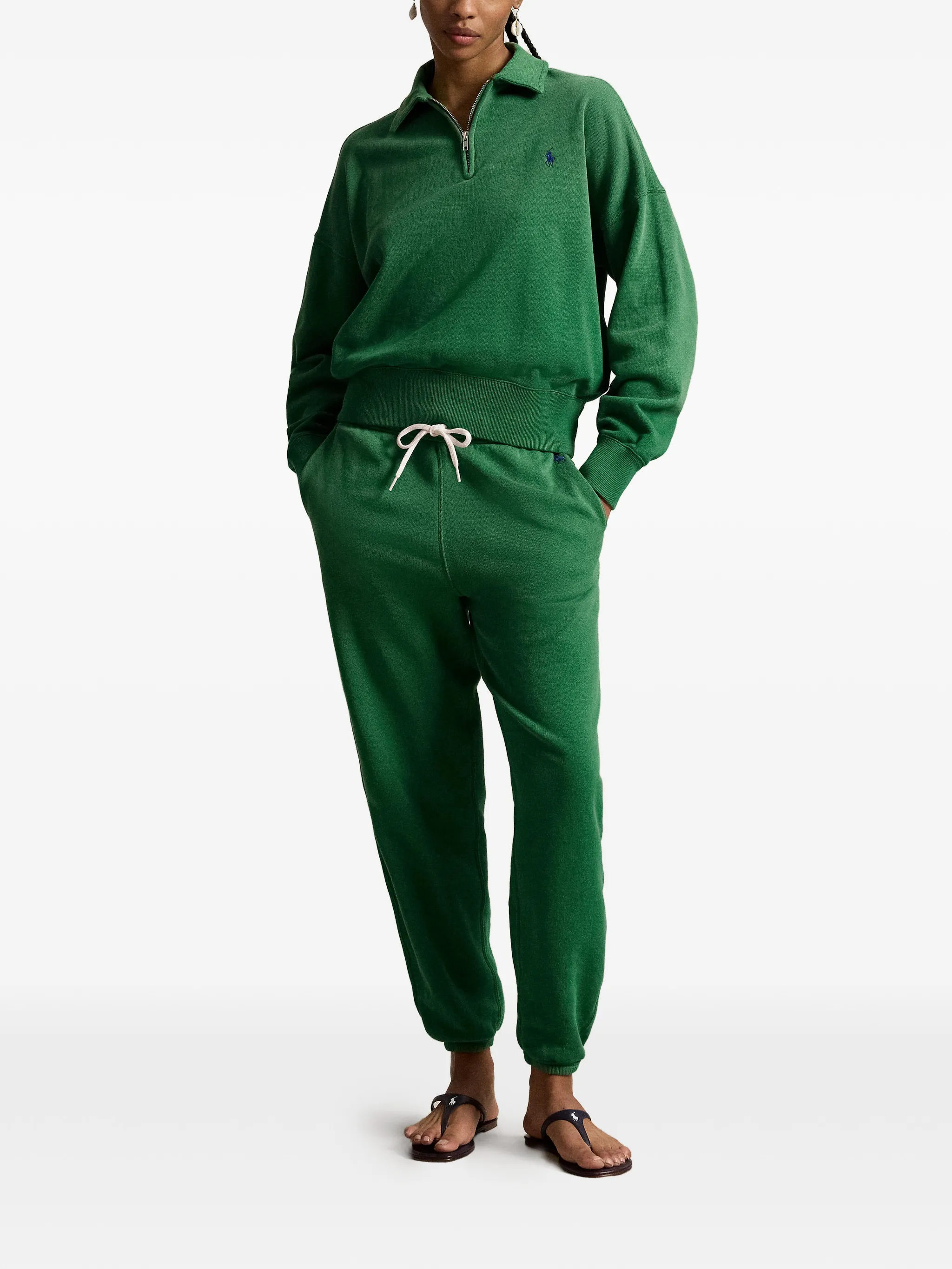 Green sweatshirt worn by a person, showing the sweatshirt‘s fit