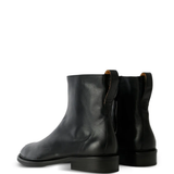 Black boots, back view