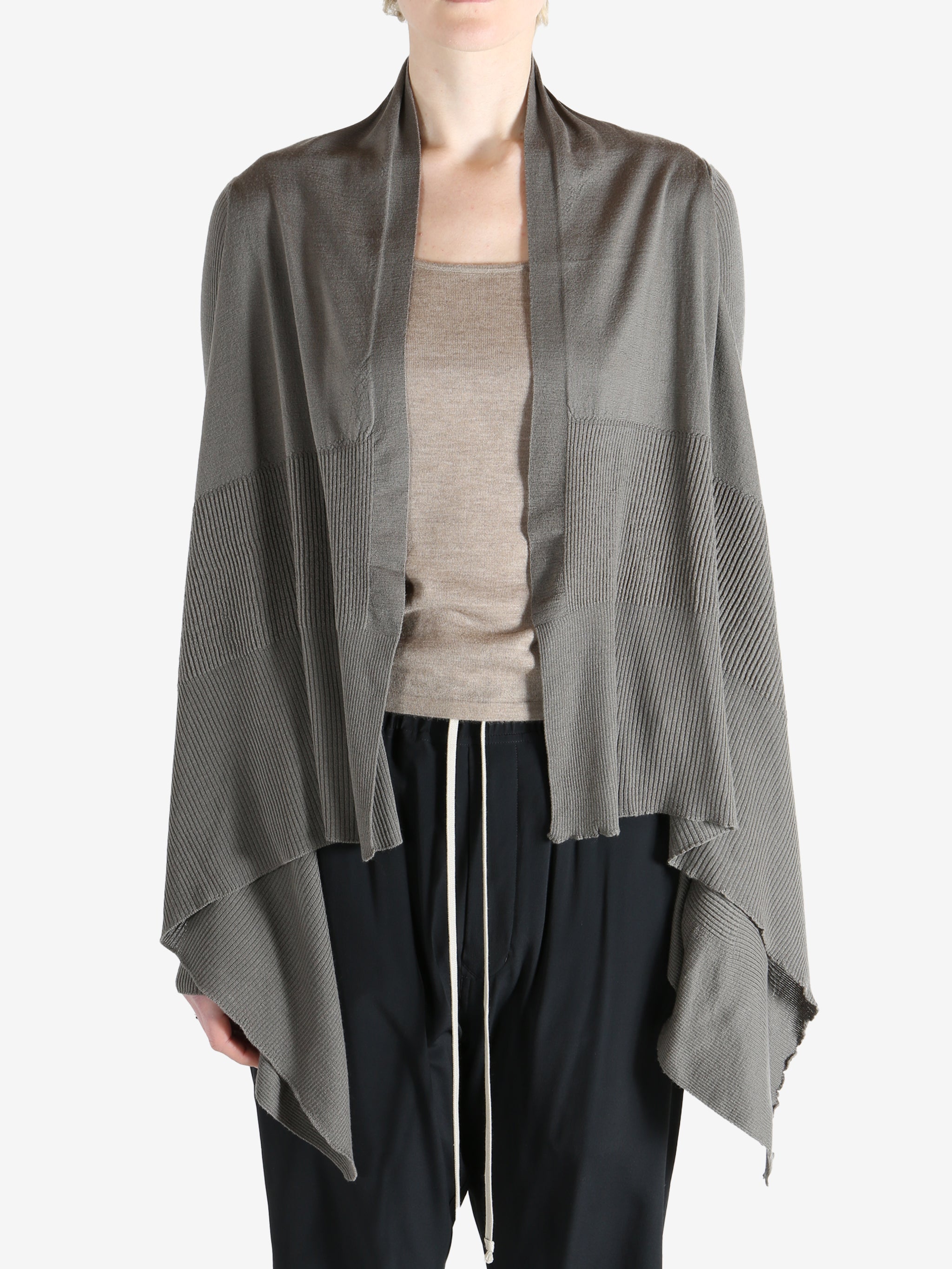 Grey knitwear worn by a person, showing the knitwear fit