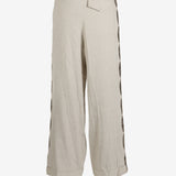 Tan pant worn by a person, showing the pant’s fit