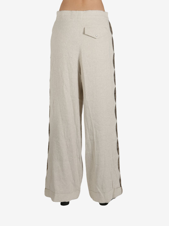 Tan pant worn by a person, showing the pant’s fit