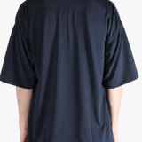 Navy t-shirt worn by a person, showing the t-shirt's fit