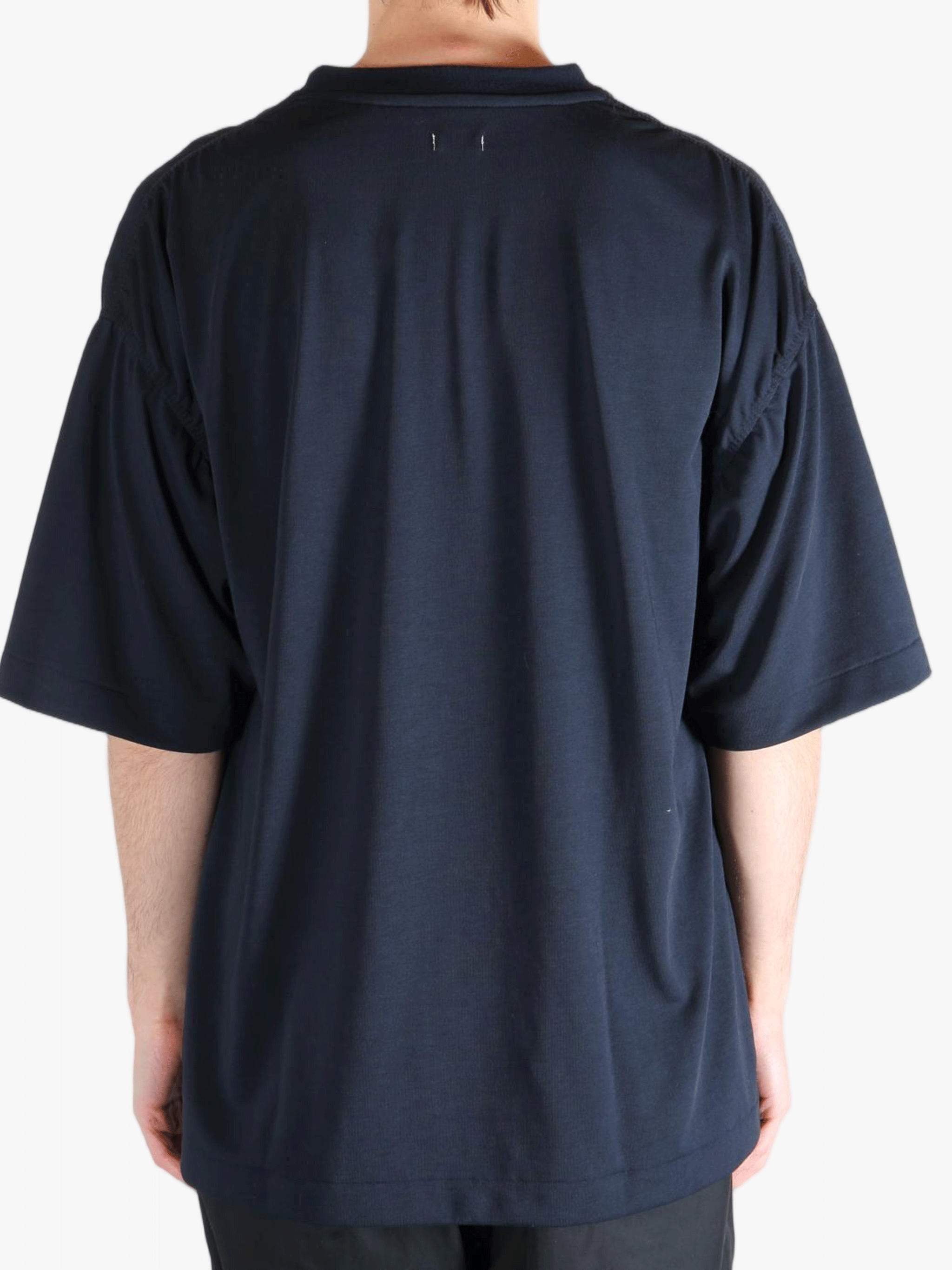 Navy t-shirt worn by a person, showing the t-shirt's fit