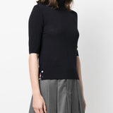 Navy T-shirt worn by a person, showing the shirt’s fit