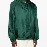 Green jackets worn by a person, showing the jackets fit