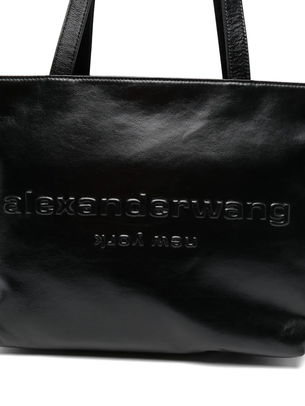 Close up of black handbag,showing texture of the leatherfabric.