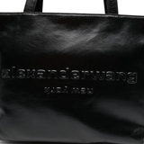 Close up of black handbag,showing texture of the leatherfabric.