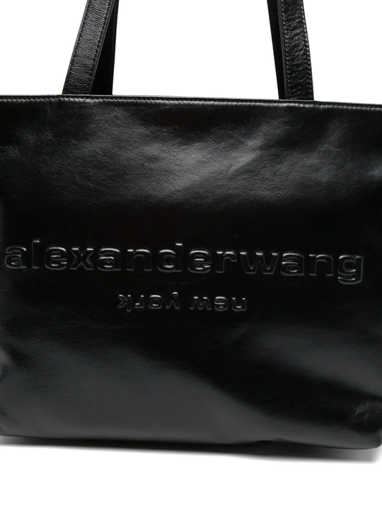 Close up of black handbag,showing texture of the leatherfabric.
