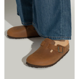 Brown shoes worn by a person, showing the shoes fit